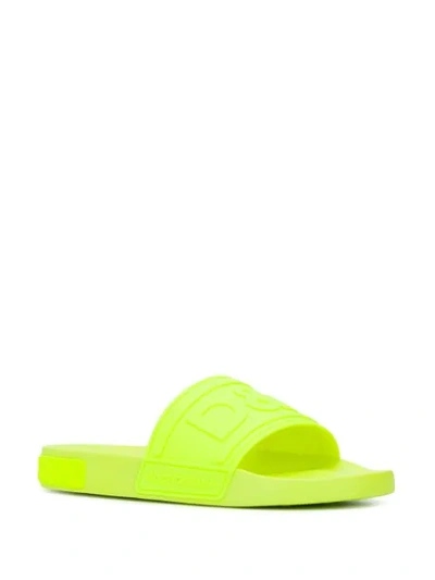 Shop Dolce & Gabbana Embossed Logo Slides In Yellow