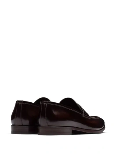 Shop Prada Penny Slot Loafers In Brown
