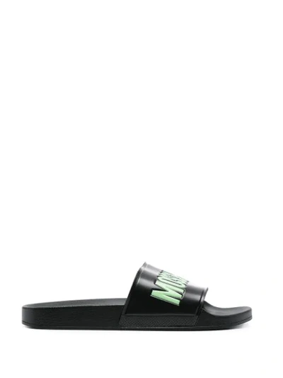 Shop Moschino Logo Embossed Slides In Black