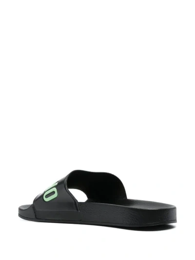 Shop Moschino Logo Embossed Slides In Black