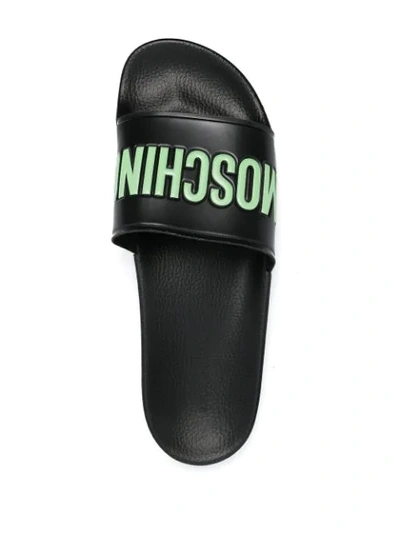 Shop Moschino Logo Embossed Slides In Black