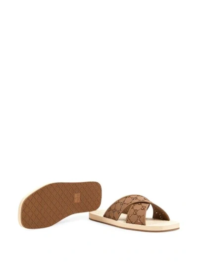 Shop Gucci Gg Slide Sandals In Brown