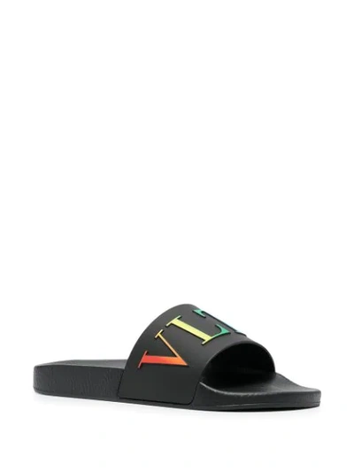 Shop Valentino Rainbow Vltn Slides In Black