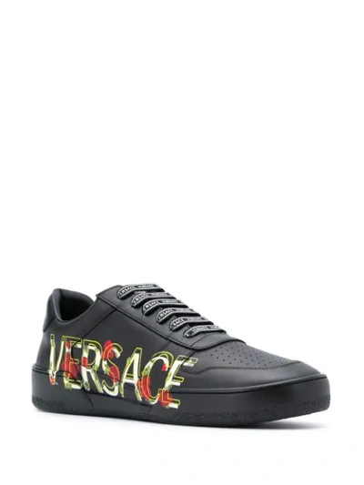 Shop Versace Logo Printed Leather Sneakers In Black