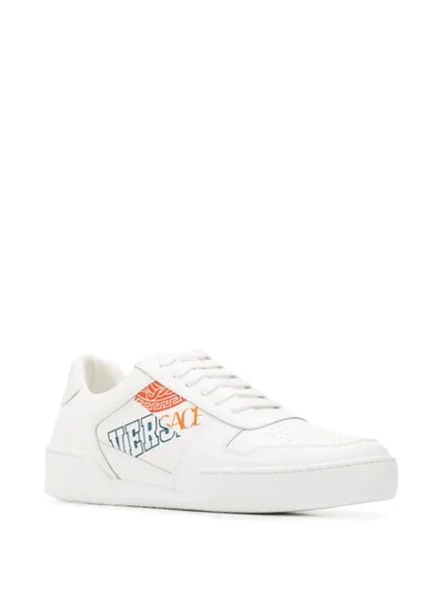 Shop Versace Logo Print Sneakers In White