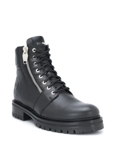 Shop Balmain Embossed Logo Combat Boots In Black