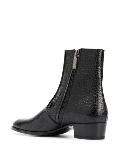 Shop Saint Laurent Wyatt Crocodile-embossed Boots In Black