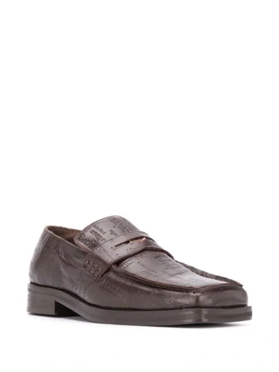 Shop Martine Rose Embossed Logo Loafers In Brown
