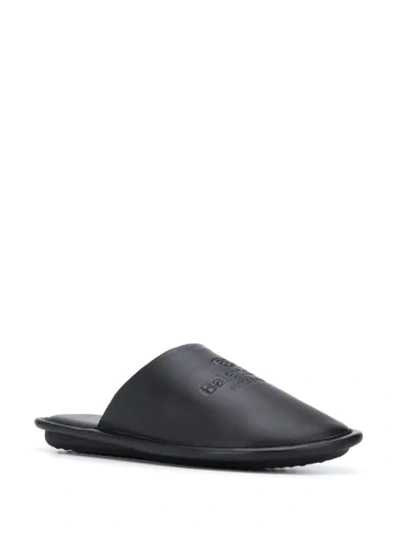 Shop Balenciaga Logo Embossed Slippers In Black