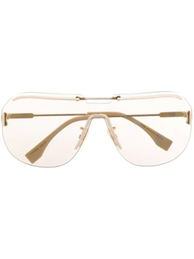 Shop Fendi Mono-frame Sunglasses In Gold