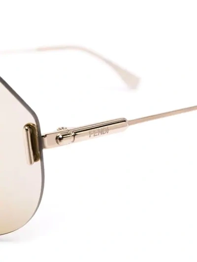 Shop Fendi Mono-frame Sunglasses In Gold