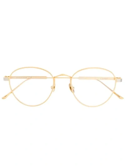 Shop Cartier Round Frame Glasses In Gold