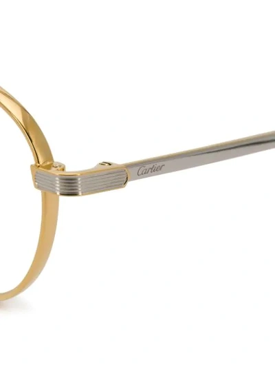 Shop Cartier Round Frame Glasses In Gold