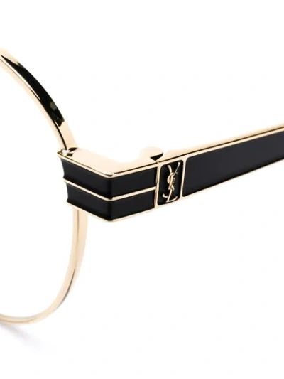 Shop Saint Laurent Round Frame Glasses In Gold