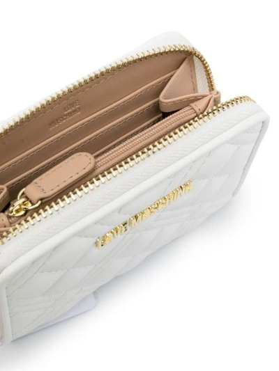 Shop Love Moschino Quilted Zip Wallet In White