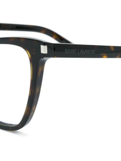 Shop Saint Laurent Cat Eye Glasses In Brown