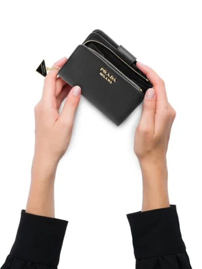 Shop Prada Charm Saffiano Wallet In Black