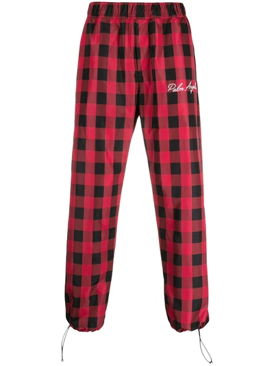 Shop Palm Angels Check Print Track Pants In Red
