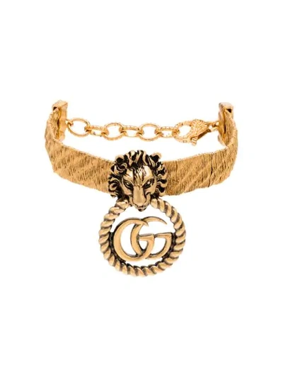 Shop Gucci Lion Head Gg Hoop Bracelet In Gold