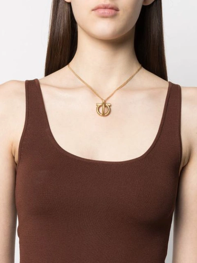 Shop Ferragamo Gancini Pendant Necklace In Gold