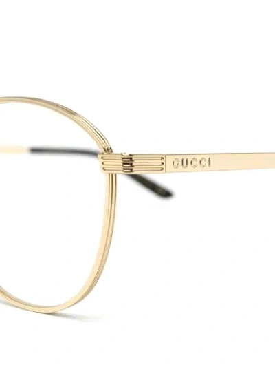 Shop Gucci Round-frame Glasses In Gold