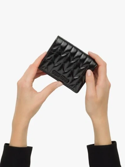 Shop Miu Miu Matelassé Compact Wallet In Black