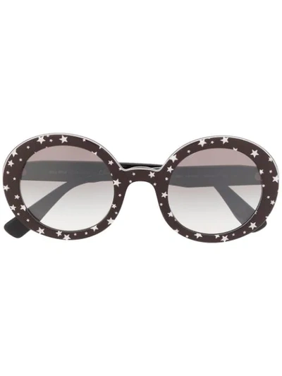 Shop Miu Miu Circle Frame Star Print Sunglasses In Black