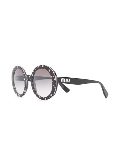 Shop Miu Miu Circle Frame Star Print Sunglasses In Black