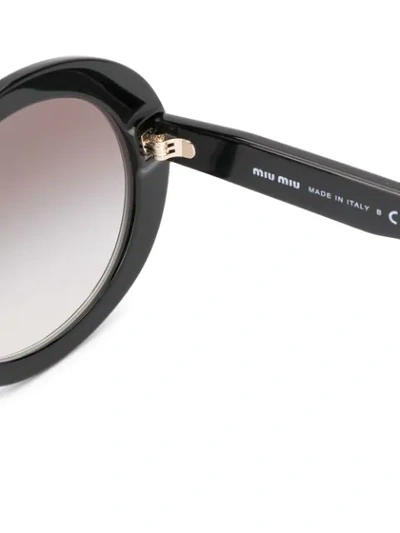 Shop Miu Miu Circle Frame Star Print Sunglasses In Black