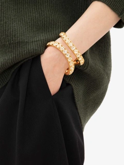 Shop Jw Anderson Crystal Loop Cuff Bracelet In Gold