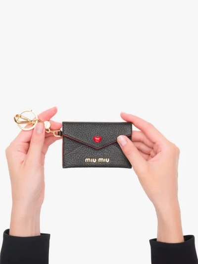 Shop Miu Miu Madras Love Mini Envelope Keyring In Black