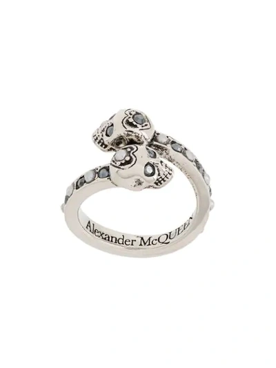 Shop Alexander Mcqueen Twin Skull Embellished Ring In Metallic