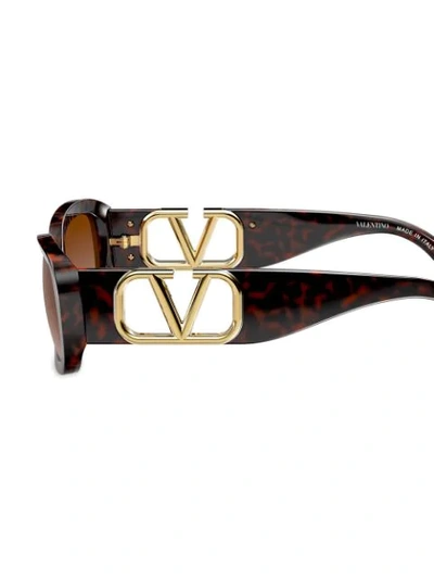 Shop Valentino Vlogo Oval Frame Sunglasses In Black