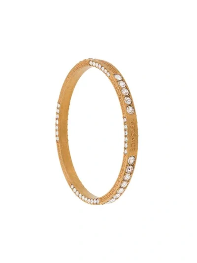 Shop Versace Greca Crystal Bangle Bracelet In Gold