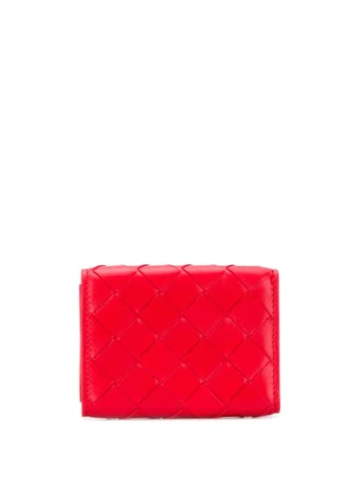 Shop Bottega Veneta Intrecciato Weave Tri-fold Wallet In Red