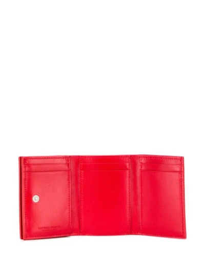 Shop Bottega Veneta Intrecciato Weave Tri-fold Wallet In Red