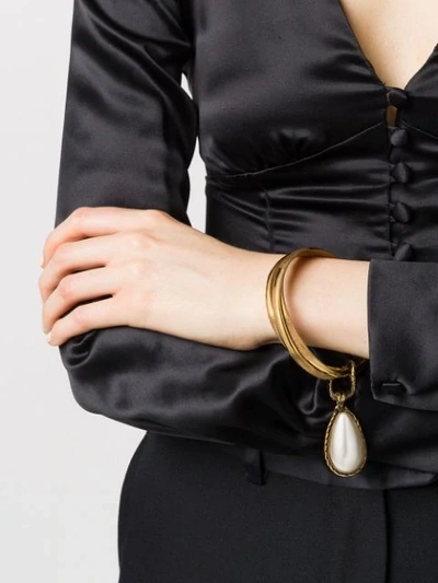Shop Alexander Mcqueen Droplet Charm Bangle In Gold