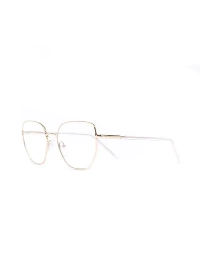 Shop Prada Oval Wire-frame Optical Glasses In Gold