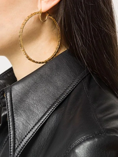 Shop Versace Greca Key Hoop Earrings In Gold
