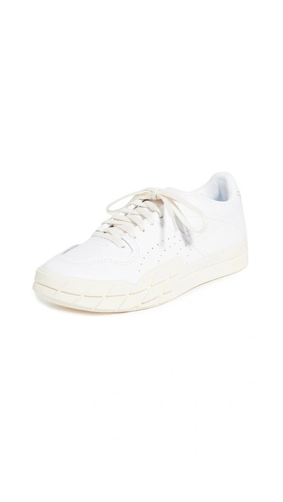 Shop Puma Eris Sneakers In  White/whisper White