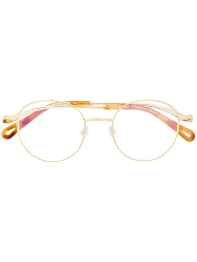 Shop Chloé Tortoiseshell Round Frame Glasses In Gold