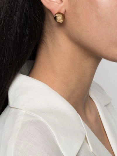 Shop Jacquemus La Boucle J Hammered Earrings In Gold