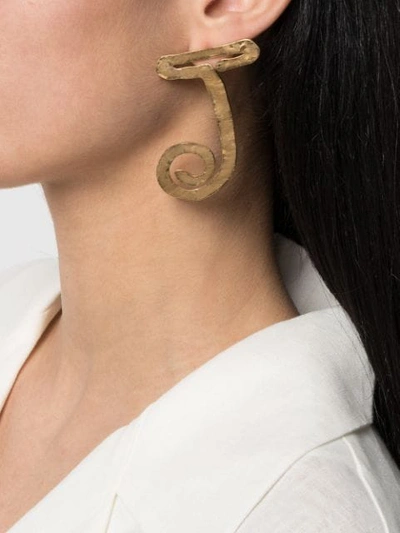 Shop Jacquemus La Boucle J Hammered Earrings In Gold