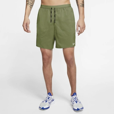 Shop Nike Flex Stride Men's Brief Running Shorts (asparagus)