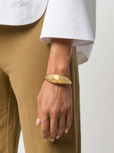 Shop Chloé Sculpted Cuff Bracelet In Gold