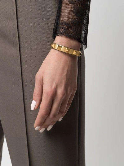 Shop Valentino Rockstud Buckled Bracelet In Gold