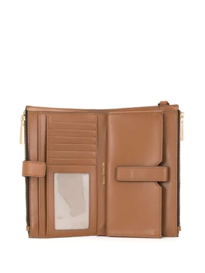 Shop Michael Michael Kors Jet Set Wallet In Brown