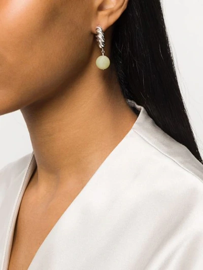 Shop Isabel Lennse Twisted Pendant Hoop Earrings In Metallic