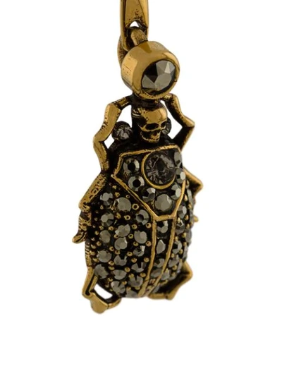 Shop Alexander Mcqueen Beetle And Skull Pendant Earring In Gold
