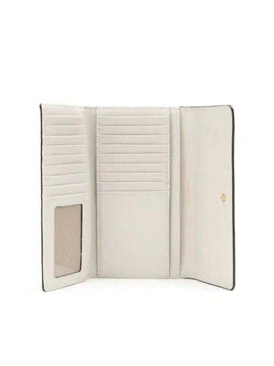 Shop Michael Michael Kors Mercer Monogram Tri-fold Wallet In White